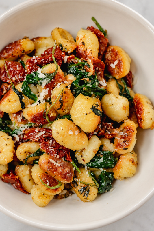 CRISPY SWEET TAHINI GNOCCHI WITH SPINACH & SUN DRIED TOMATOES